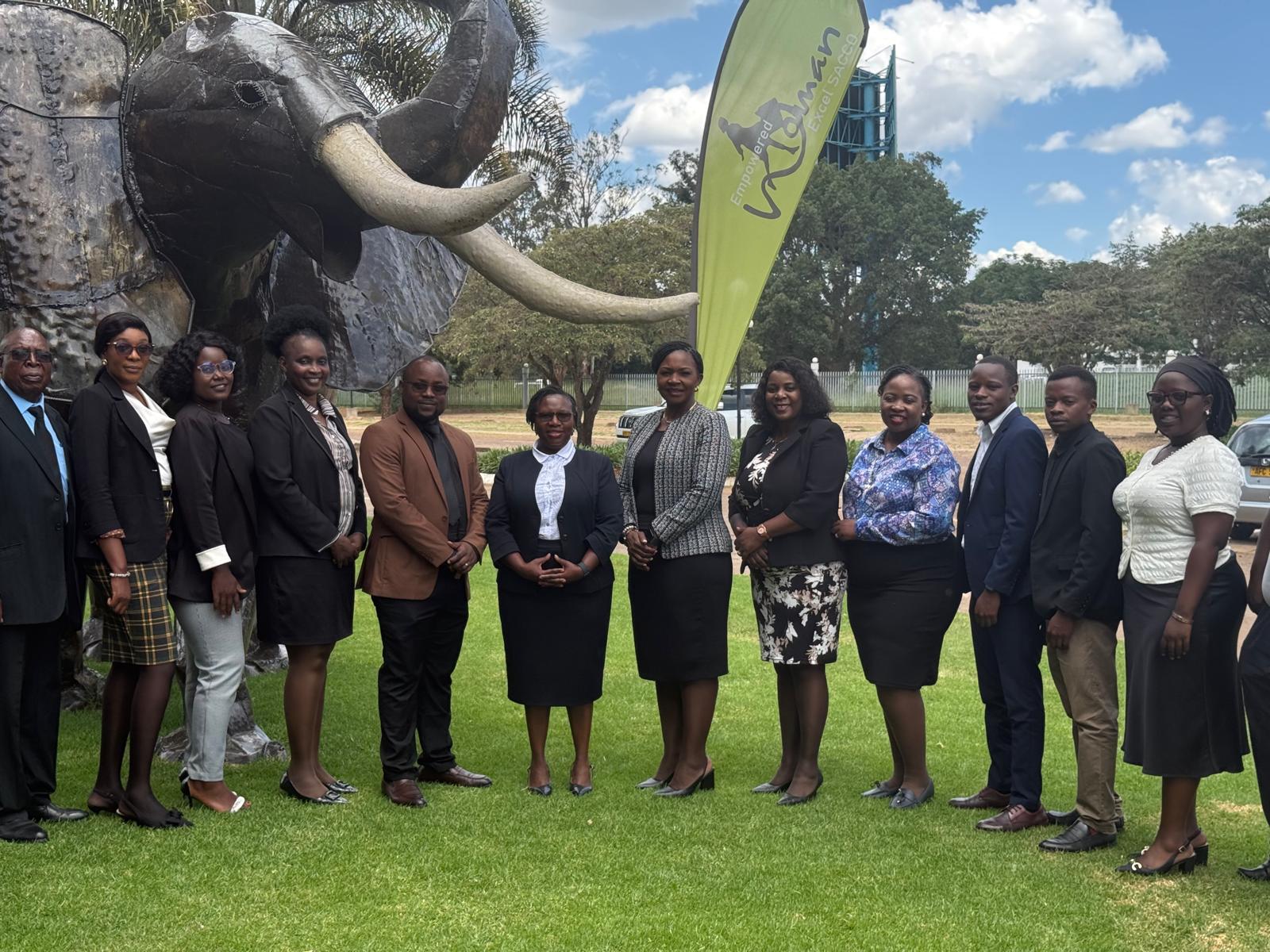 Our staff standing in front of an elephant statue